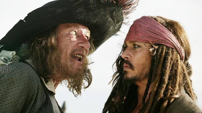 Rush as Captain Barbossa with Captain Jack Sparrow (Johnny Depp) in Pirates of the Caribb